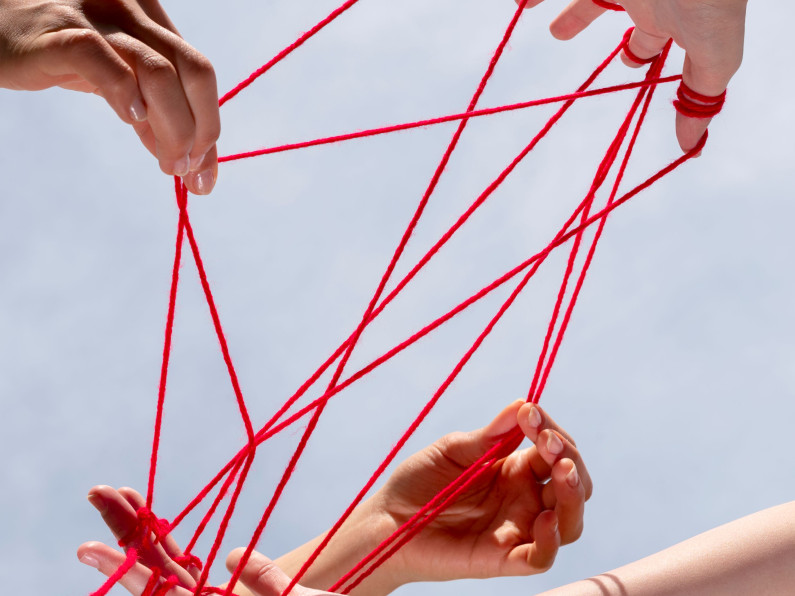 human hands connected with red thread v2